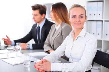Group of Business people at meeting, focus on blond business woman