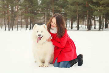 Winter and people concept - happy smiling young woman having fun
