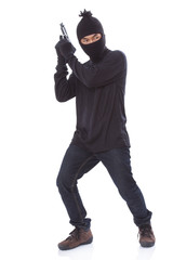 Burglar holding hand gun 