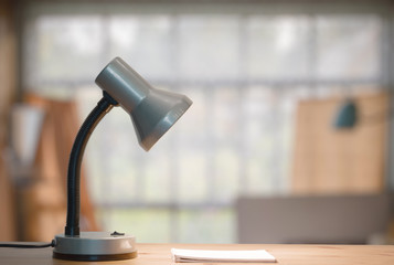 lamp and notebook on table