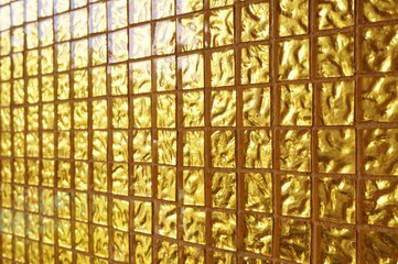 Gold colored square tile mosaic background