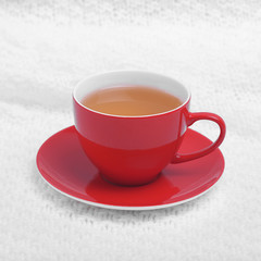 Red cup on a white plaid.