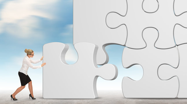 business woman building a white puzzle on a sky background

