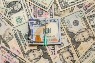 different dollar bills as background