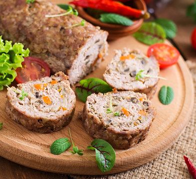 Minced meat loaf roll with mushrooms and carrots