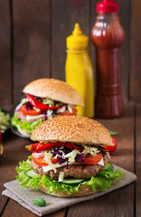 Sandwich hamburger with juicy burgers, cheese and mix of cabbage