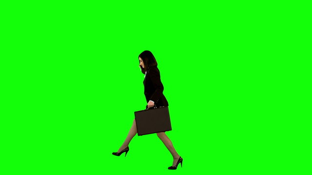 Businesswoman jumping on green screen
