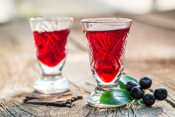 Sweet liqueur with chokeberries and alcohol