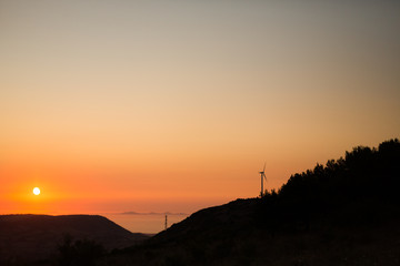 sunset silhouette with sea in background