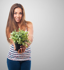 portrait of a girl holding a plant