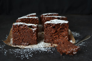 Brownie with lime on a dark background