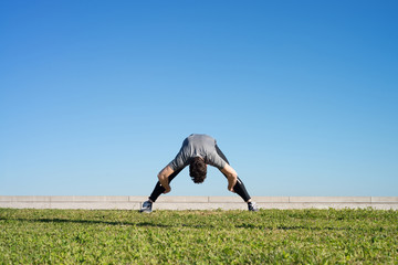 Man doing strechings before running space for text