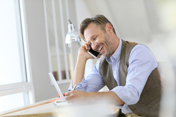 Businessman at work talking on the phone