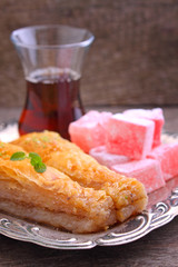 baklava with walnuts and Turkish delight with tea in Turkish