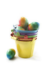Easter eggs in colorful buckets