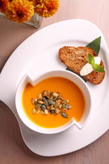 pumpkin soup in a white plate