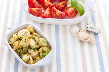 Serving with shrimp and herbs