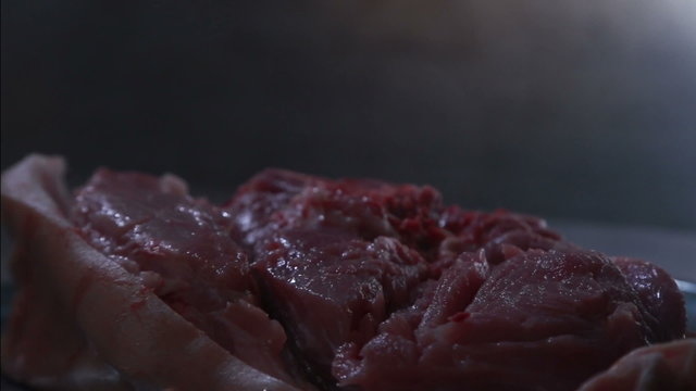 Juicy piece of meat cut with an ax