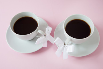 Coffee cups with ribbon on the handle