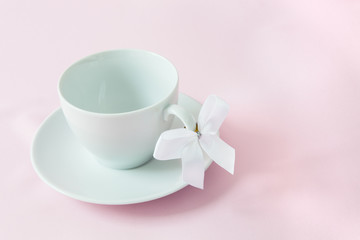 Fototapeta na wymiar Coffee cups with ribbon on the handle