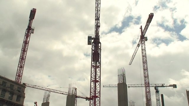 Large tower cranes on construction site
