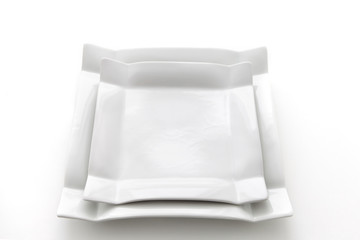 White plates on  white background