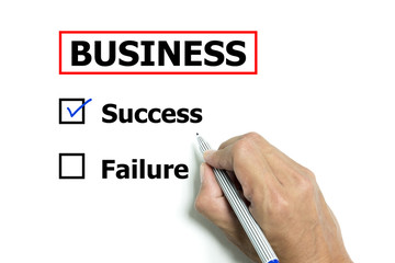 Isolated hand and pen to design business 'success or failure'