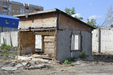 The remains of the old destroyed wooden house