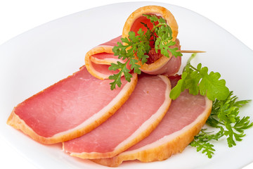 Sliced balyk on a white plate