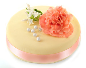 Cake with sugar paste flowers, isolated on white