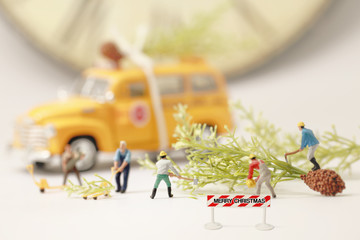 Workers(miniature) preparing Christmas presents.Selective focus
