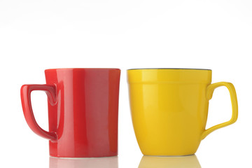 Red And Yellow Mugs / High resolution image of red and yellow mugs on white background shot in studio