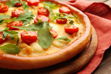 Pizza Margherita with arugula, close-up