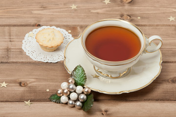 Cup Of Tea. Mince Pie. Shining Stars. Wooden Background With Cop