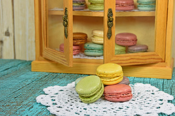 macaroons on lace doily and in pantry