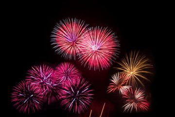 Colorful fireworks over night sky,red fireworks lines in black b