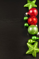 Christmas tree decorations on a black background