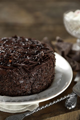 Tasty chocolate cake on wooden background