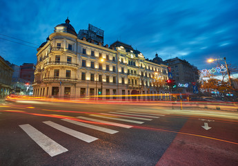 Fototapeta na wymiar BUCHAREST, DEC 2015: Night Lights on Calea Victoriei Street, near Grand Hotel Boulevard.