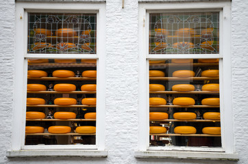 Cheese for sale behind two windows