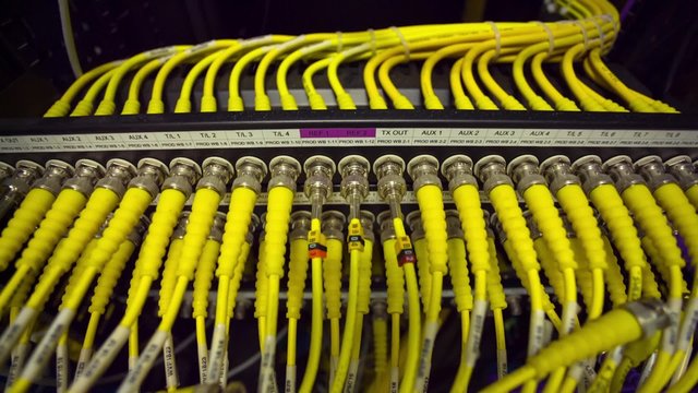 Back Side Of Modern Working Data Center Servers With Yellow Cable - Cloud Service And E-Commerce, Upload And Download Server  - Tilt Down