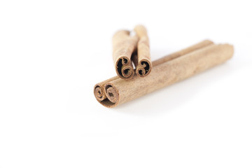 Two cinnamon sticks isolated on white background. Close up.