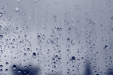 Naklejka na ściany i meble Rain drops on window , rainy day