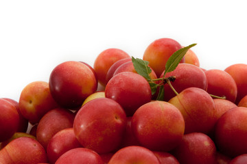 Naklejka na ściany i meble Fresh fruits of plums on a white background
