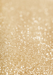 Gold defocused glitter background.
