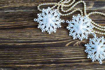 Snowflakes border on wooden background