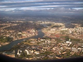 Aerial view from window plane of Oporto Portugal at the sunset