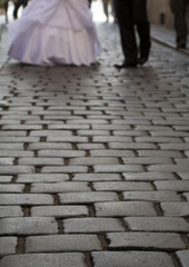 empty street at night with the bride and groom in the long run