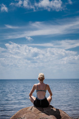 Young Woman doing Lotus Yoga Position