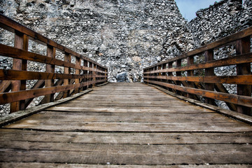 Wooden bridge in the castle, Bridge in the ruins, Entrance Bridge to the castle, path in castle and blue sky © Matt Benzero